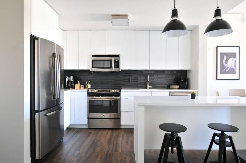 White kitchen with installed cabinets and island